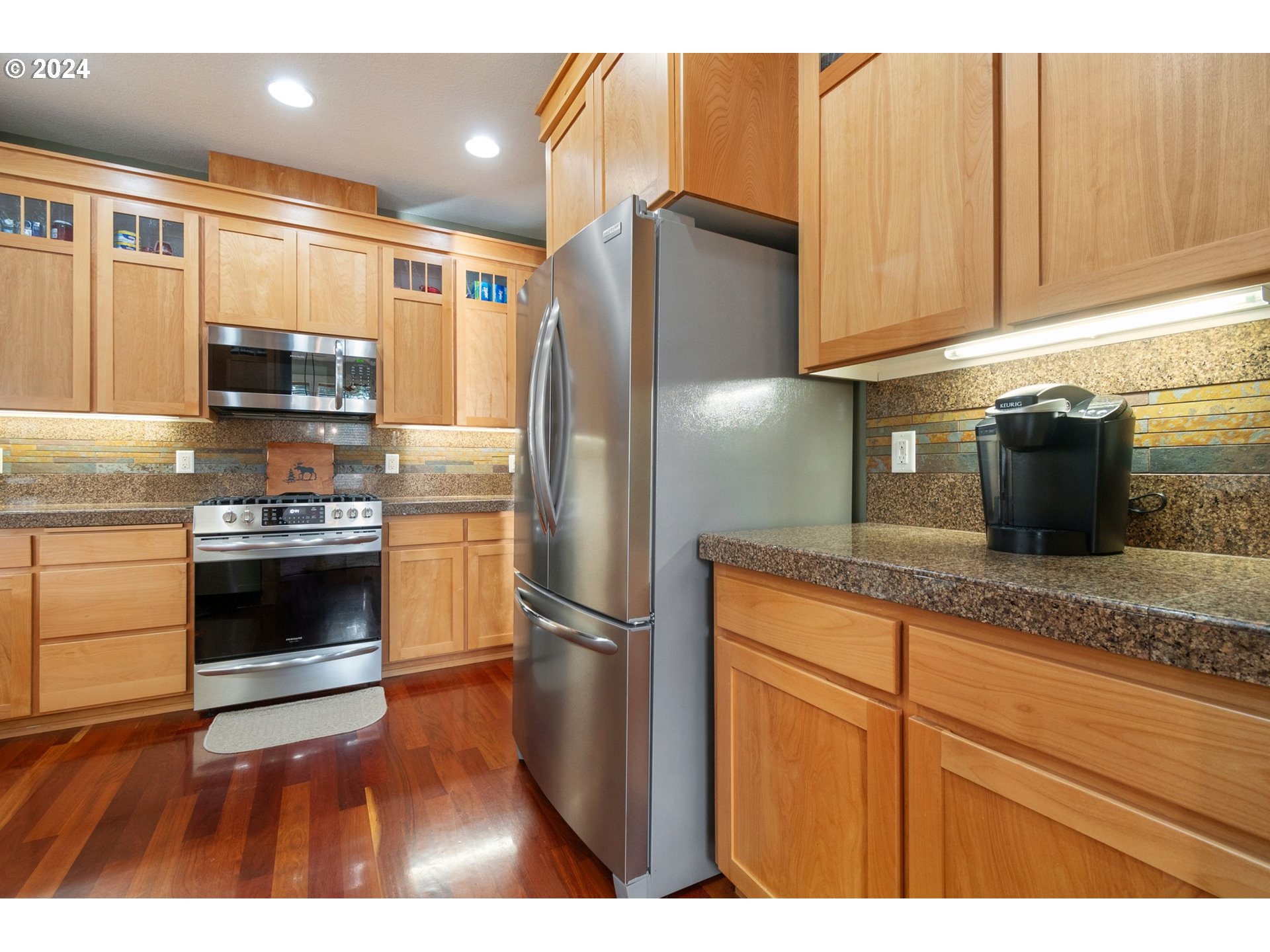 941 Northwest Angel Heights Road Stevenson, WA 98648 - Photo 19 of 38 a kitchen with granite countertop stainless steel appliances and wooden cabinets