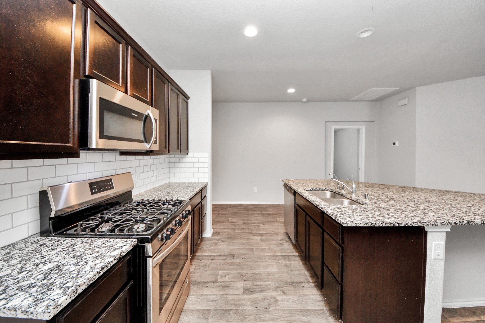 8302 Rose Petals Lane Rosharon, TX 77583 - Photo 12 of 42 Stainless appliance and kitchen perspective