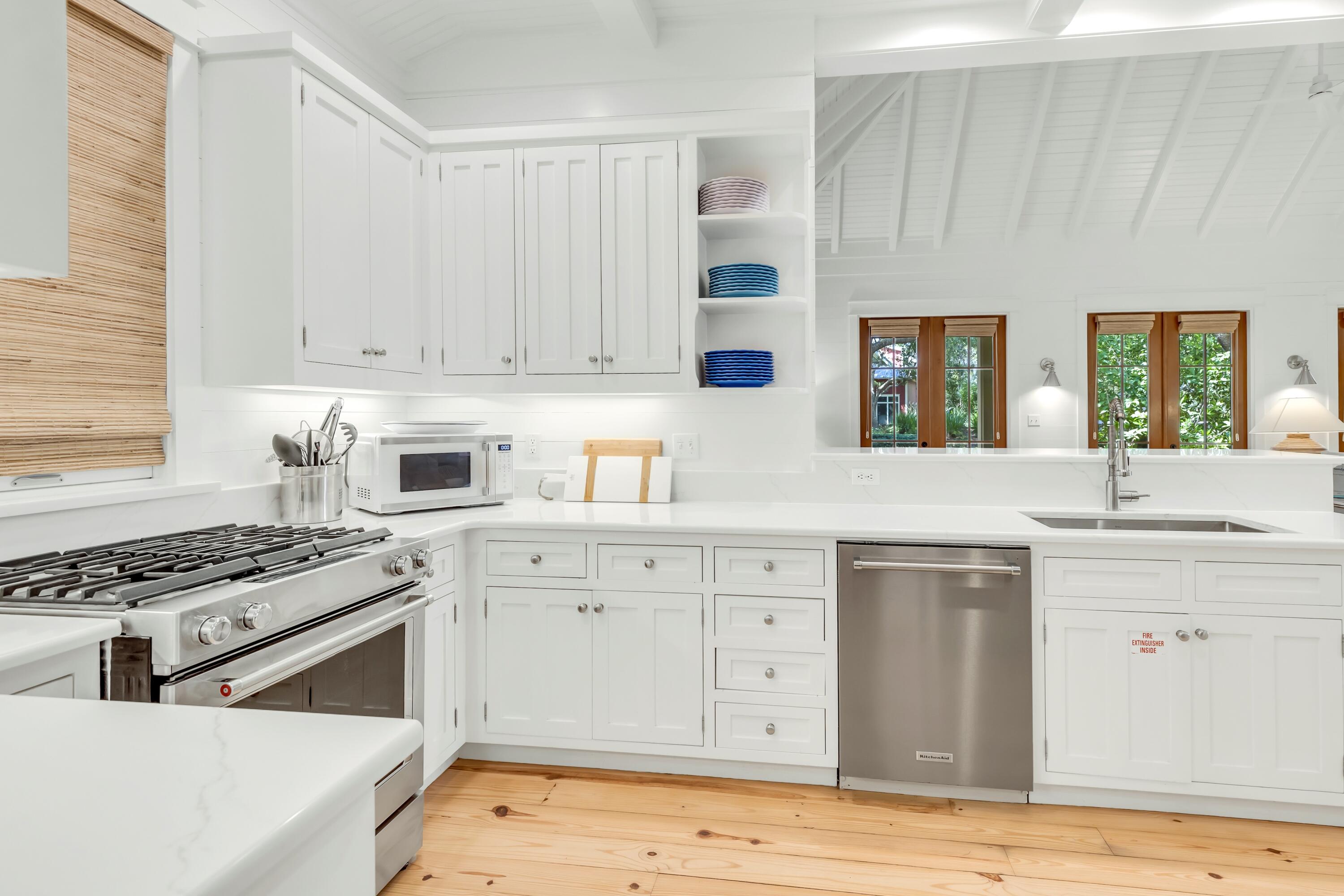 114 Sunset Ridge Lane Santa Rosa Beach, FL 32459 - Photo 16 of 90 a kitchen with stainless steel appliances granite countertop a stove a sink and a refrigerator