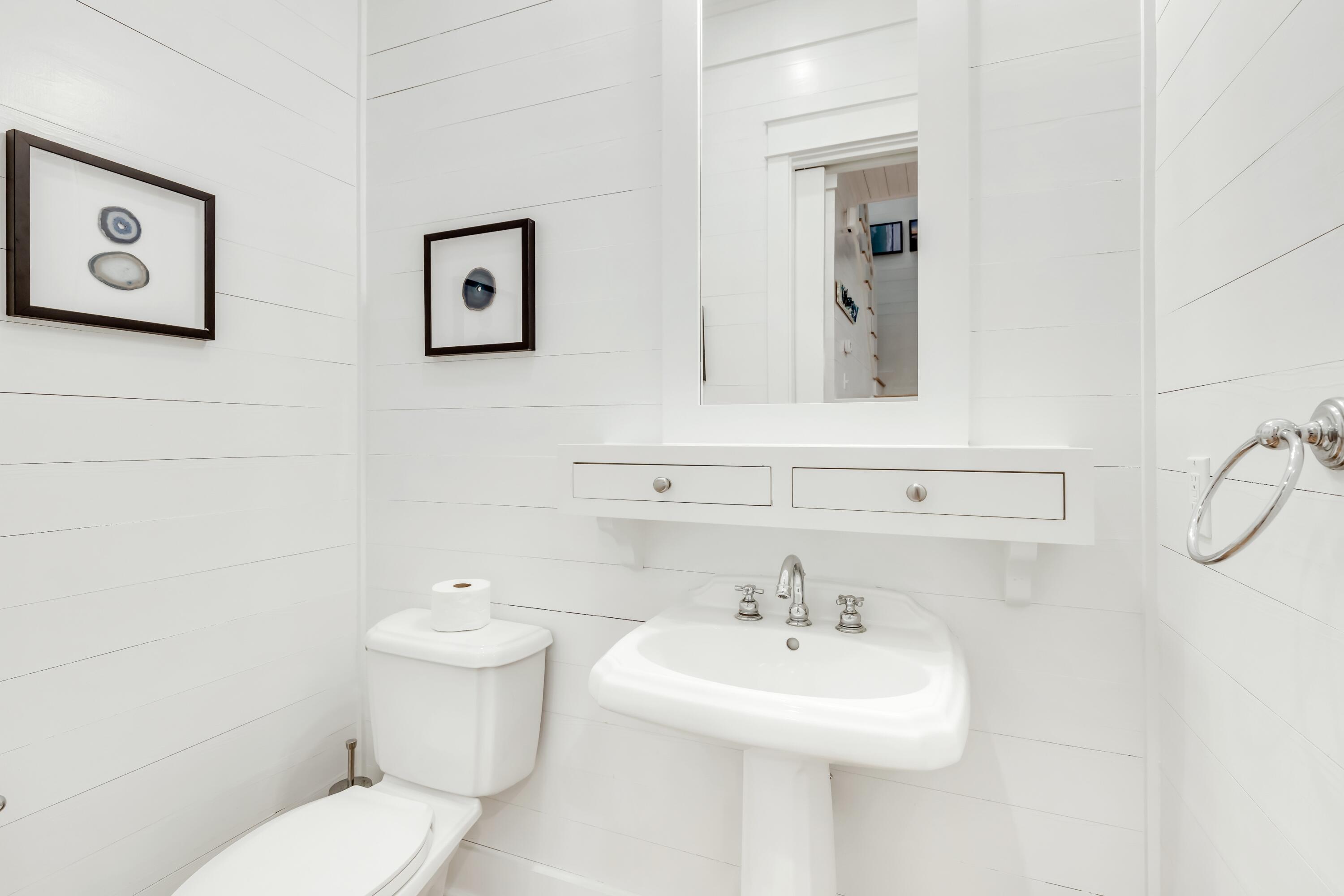 114 Sunset Ridge Lane Santa Rosa Beach, FL 32459 - Photo 19 of 90 a bathroom with a sink mirror and toilet