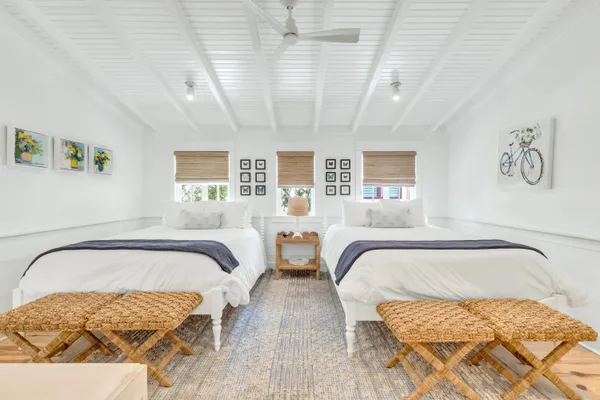 a balcony with furniture and wooden floor