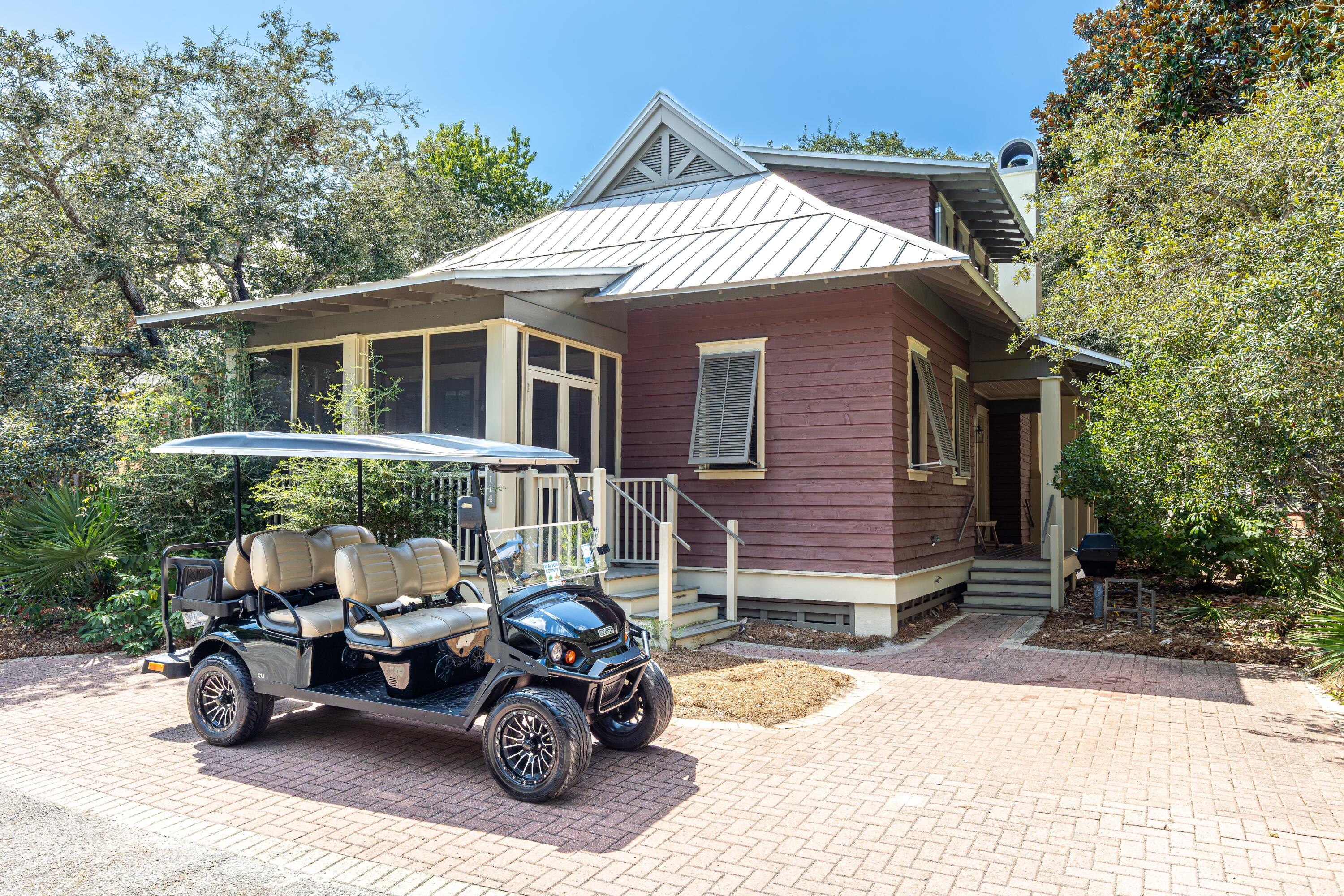 114 Sunset Ridge Lane Santa Rosa Beach, FL 32459 - Photo 42 of 90 a front view of a house with a garden and parking space