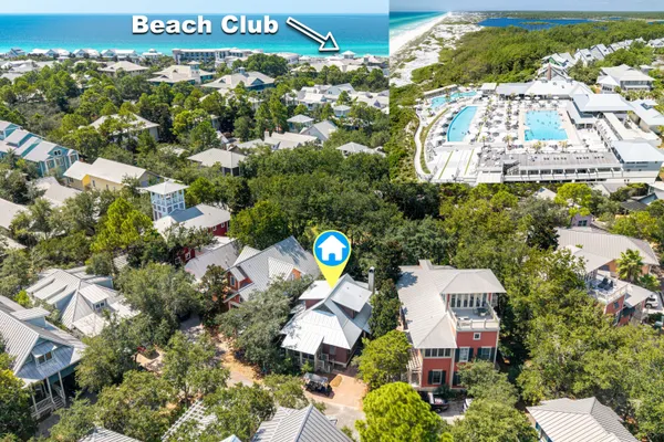 an aerial view of a house with a yard and lake view