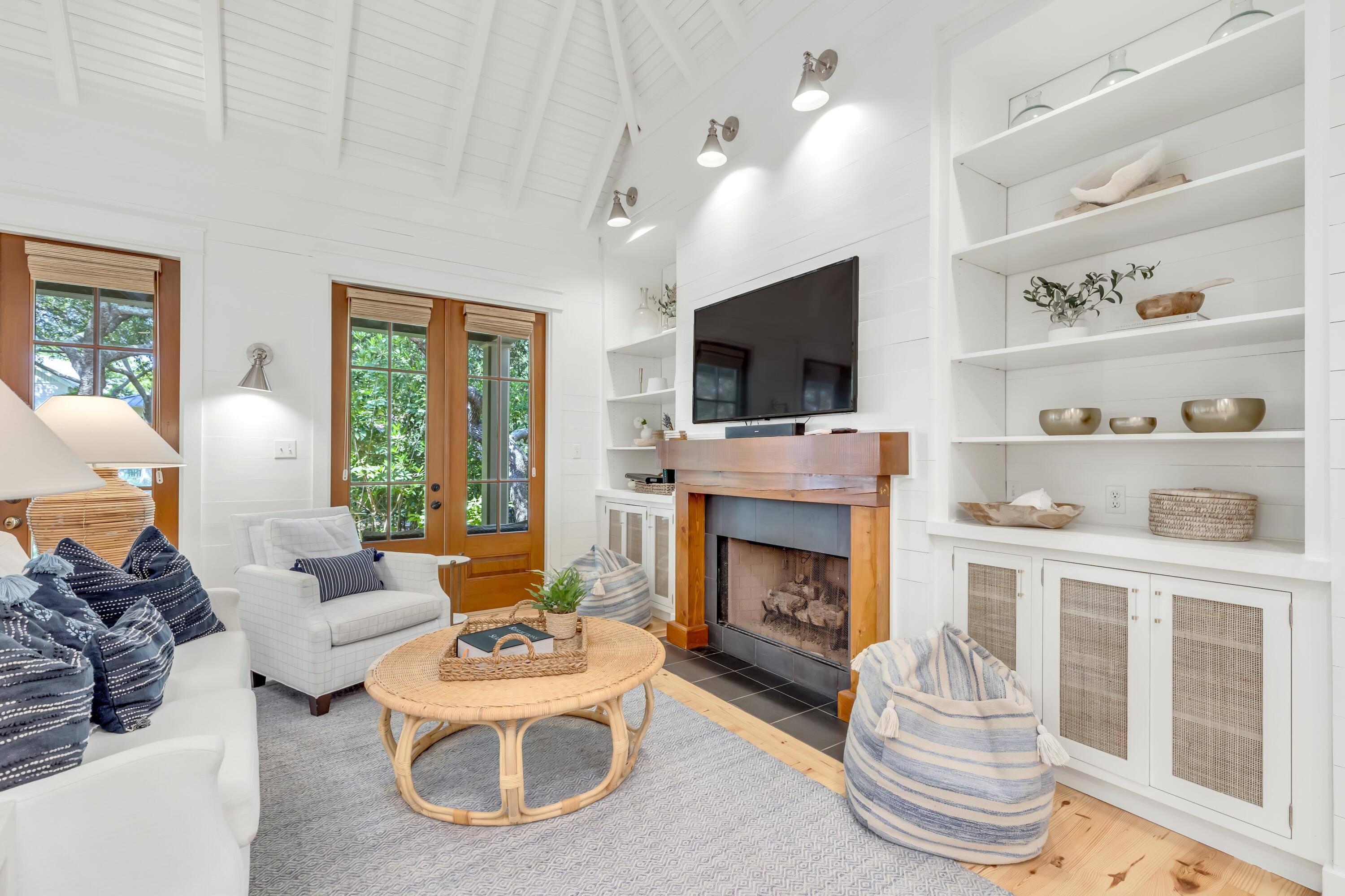 114 Sunset Ridge Lane Santa Rosa Beach, FL 32459 - Photo 9 of 90 a living room with furniture a fireplace and a flat screen tv