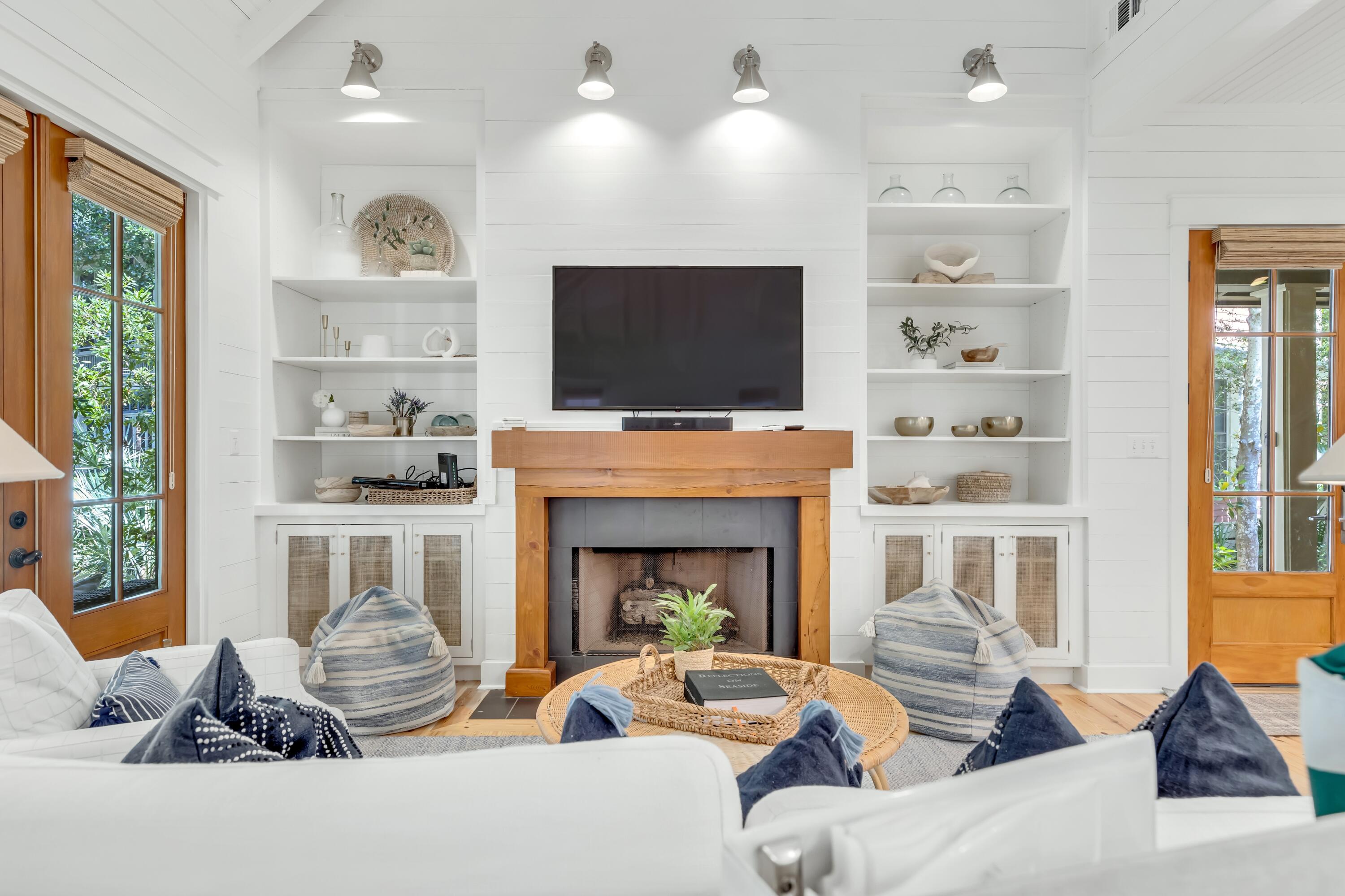 114 Sunset Ridge Lane Santa Rosa Beach, FL 32459 - Photo 10 of 90 a living room with furniture a fireplace and a flat screen tv