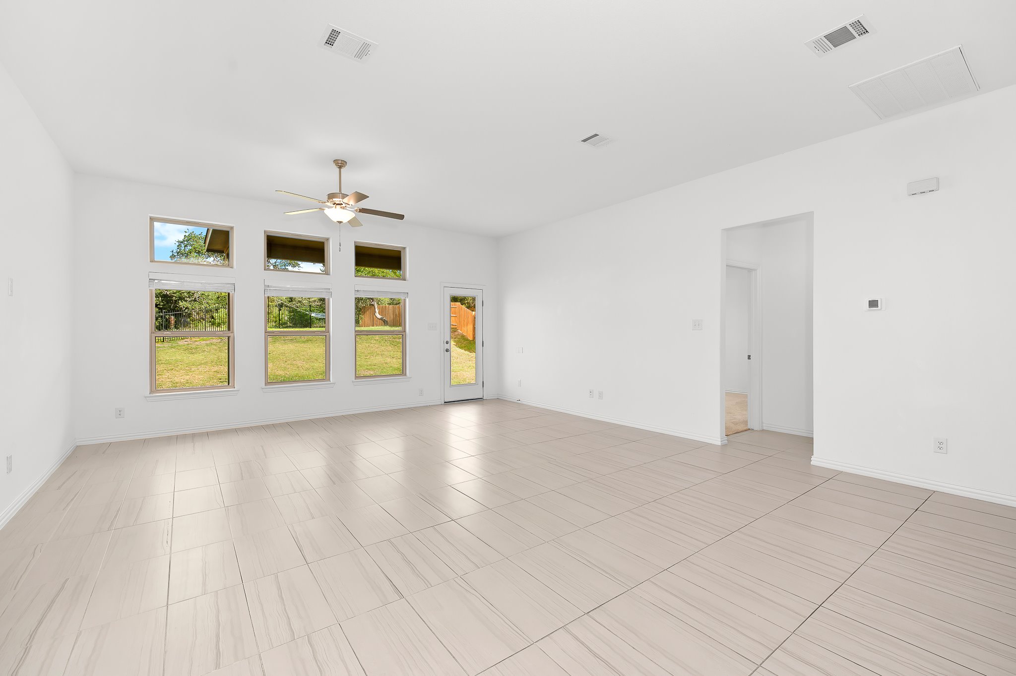1128 Ridge Runner Drive Georgetown, TX 78628 - Photo 16 of 40 Unfurnished room featuring a ceiling fan and baseboards
