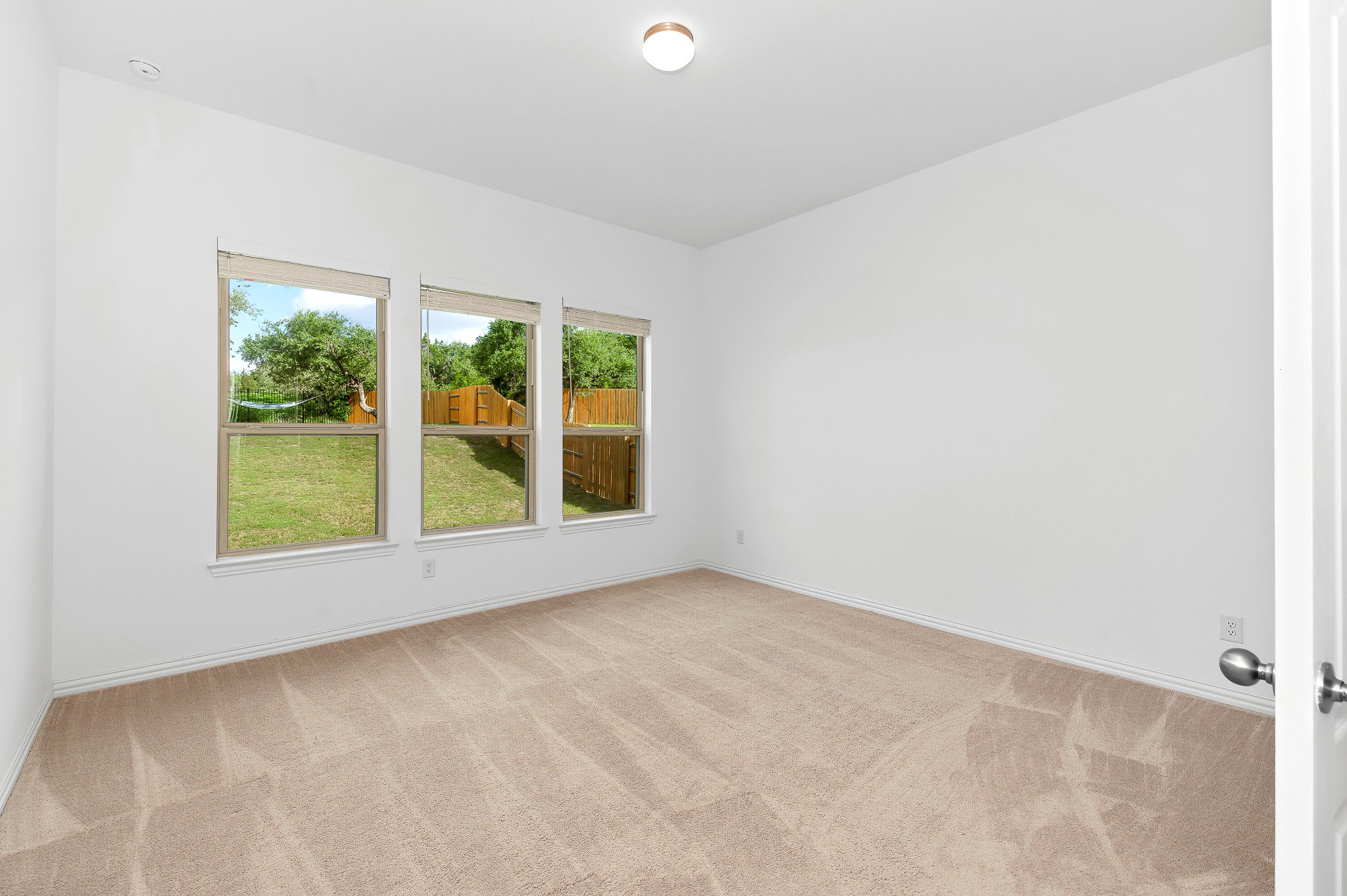 1128 Ridge Runner Drive Georgetown, TX 78628 - Photo 18 of 40 Spare room featuring light carpet and baseboards