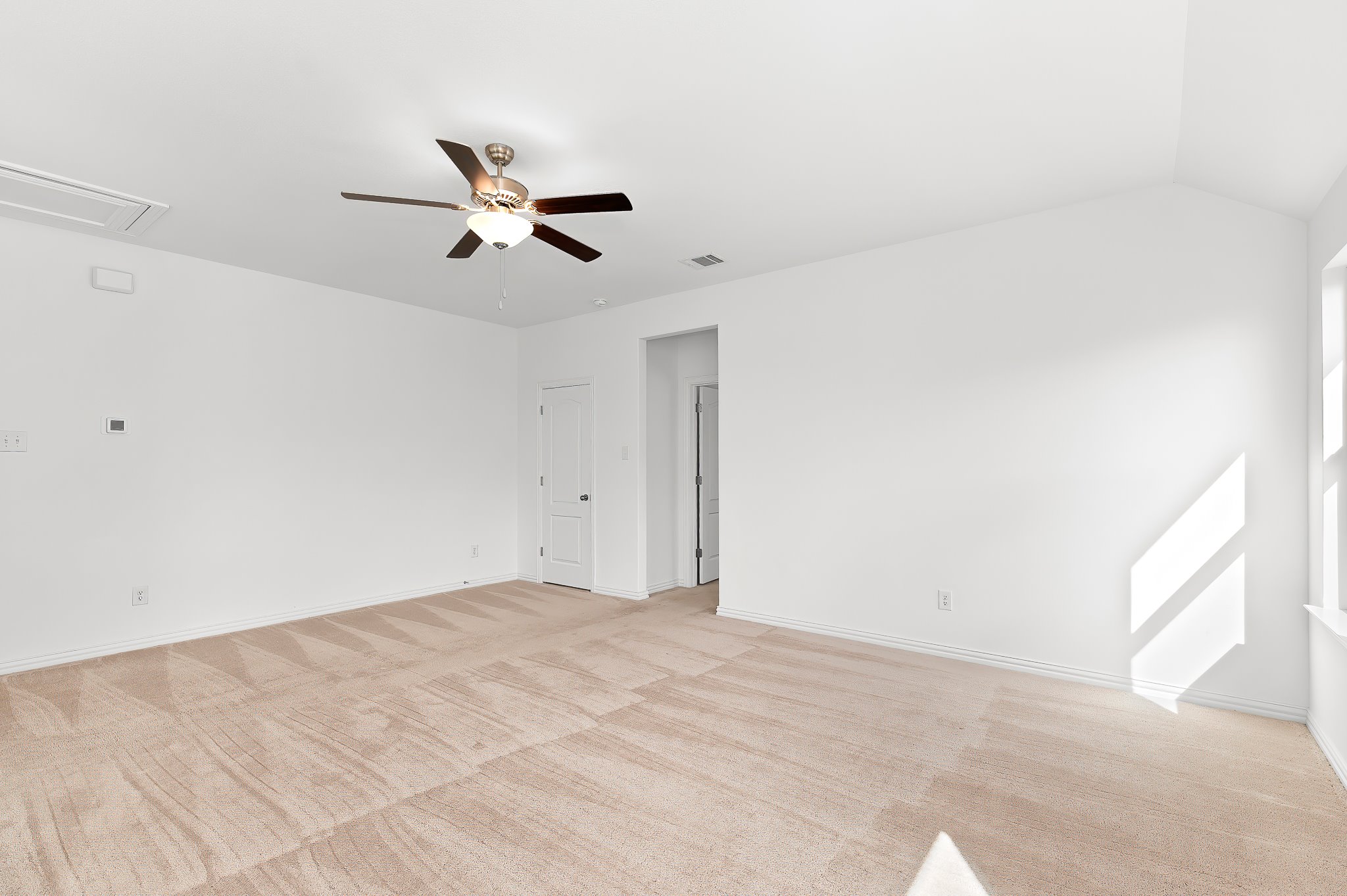 1128 Ridge Runner Drive Georgetown, TX 78628 - Photo 22 of 40 Empty room with a ceiling fan, light carpet, and lofted ceiling