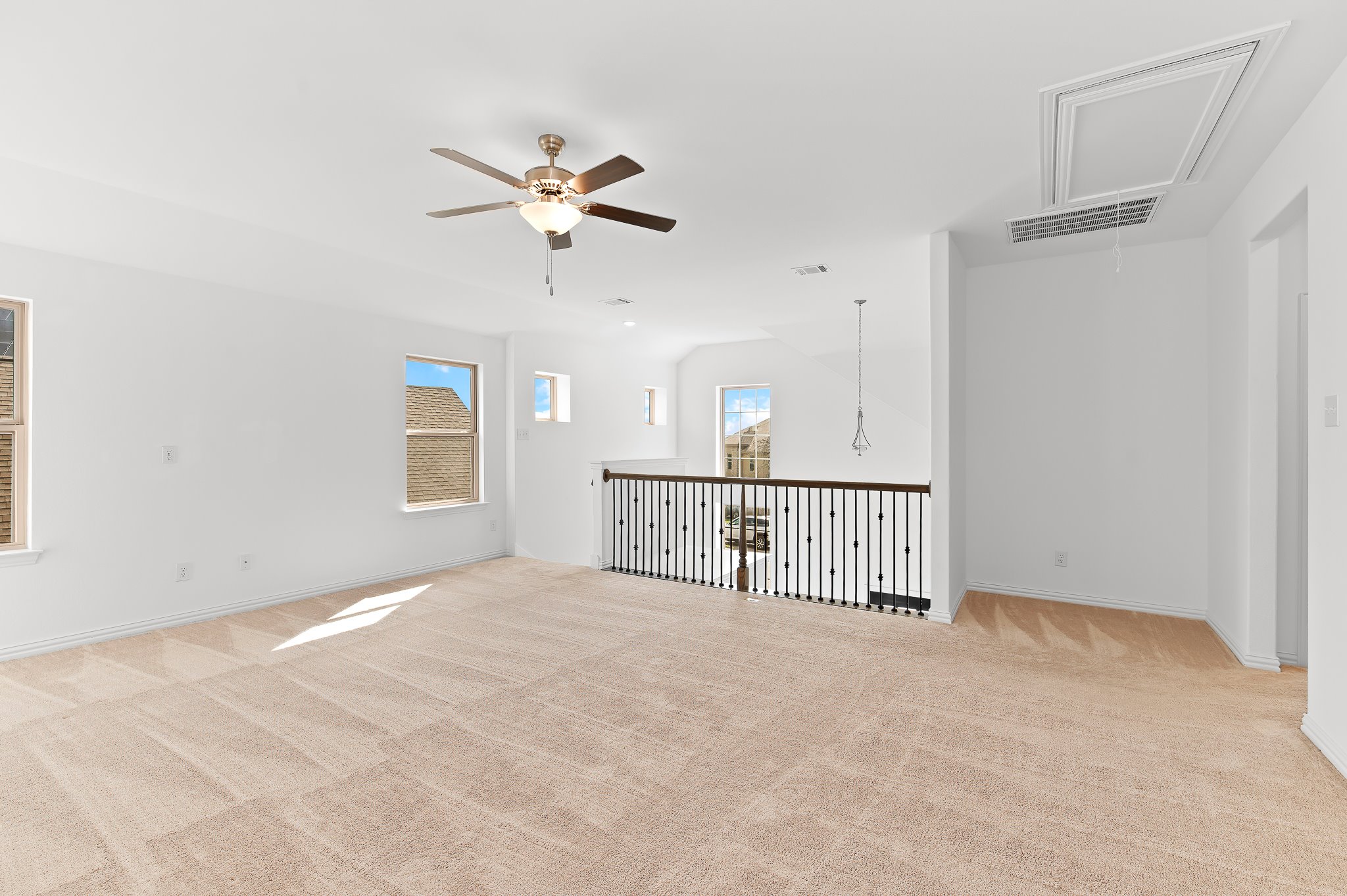 1128 Ridge Runner Drive Georgetown, TX 78628 - Photo 24 of 40 Empty room with light carpet and a ceiling fan