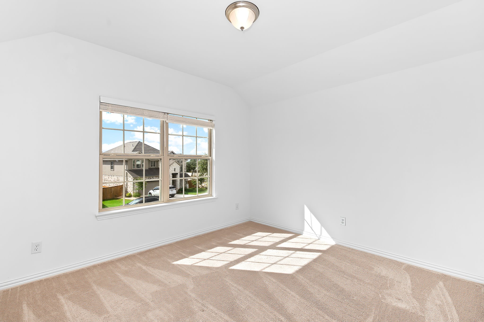 1128 Ridge Runner Drive Georgetown, TX 78628 - Photo 26 of 40 Empty room with lofted ceiling and light carpet