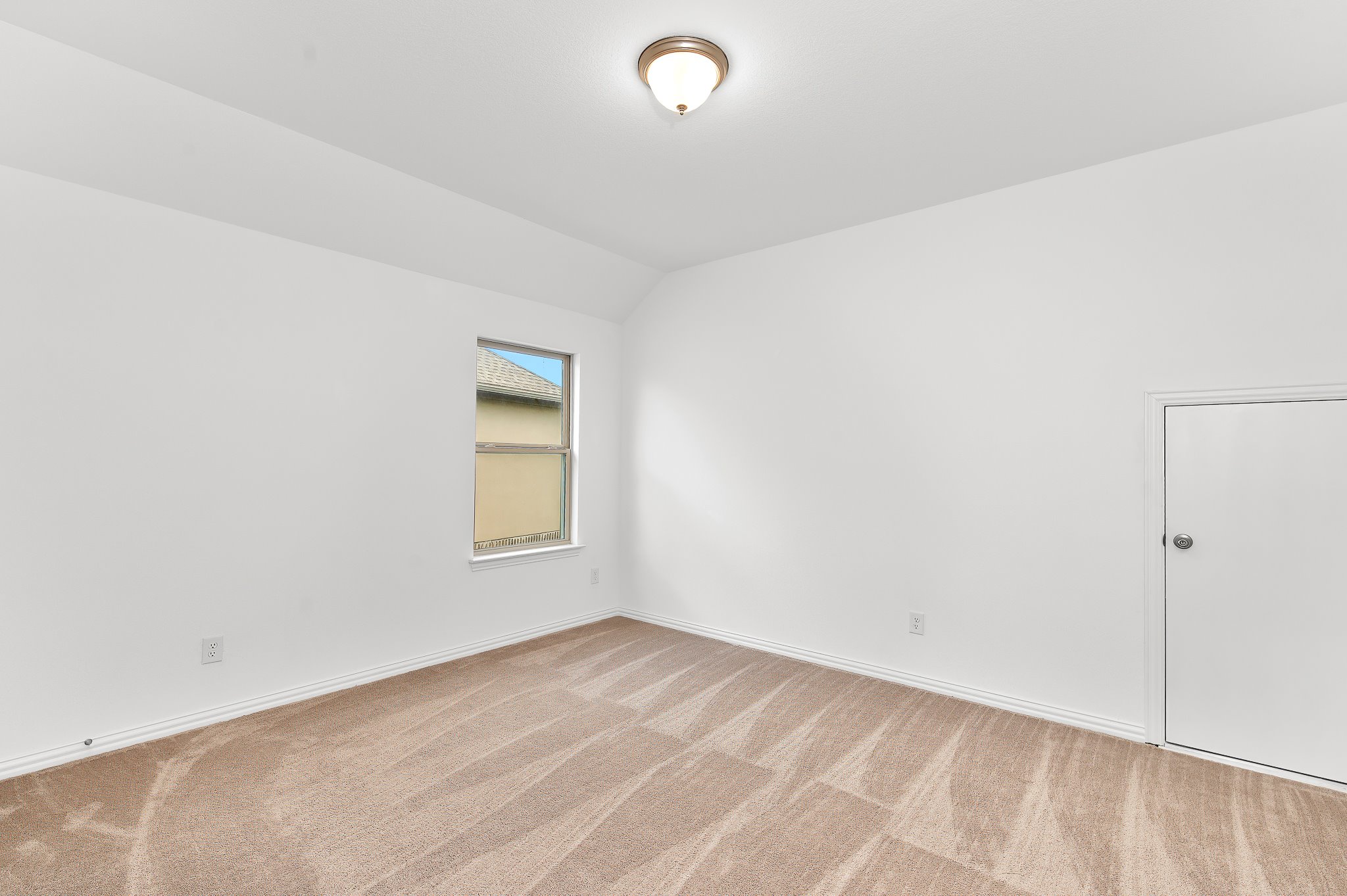 1128 Ridge Runner Drive Georgetown, TX 78628 - Photo 29 of 40 Unfurnished room with vaulted ceiling and light carpet