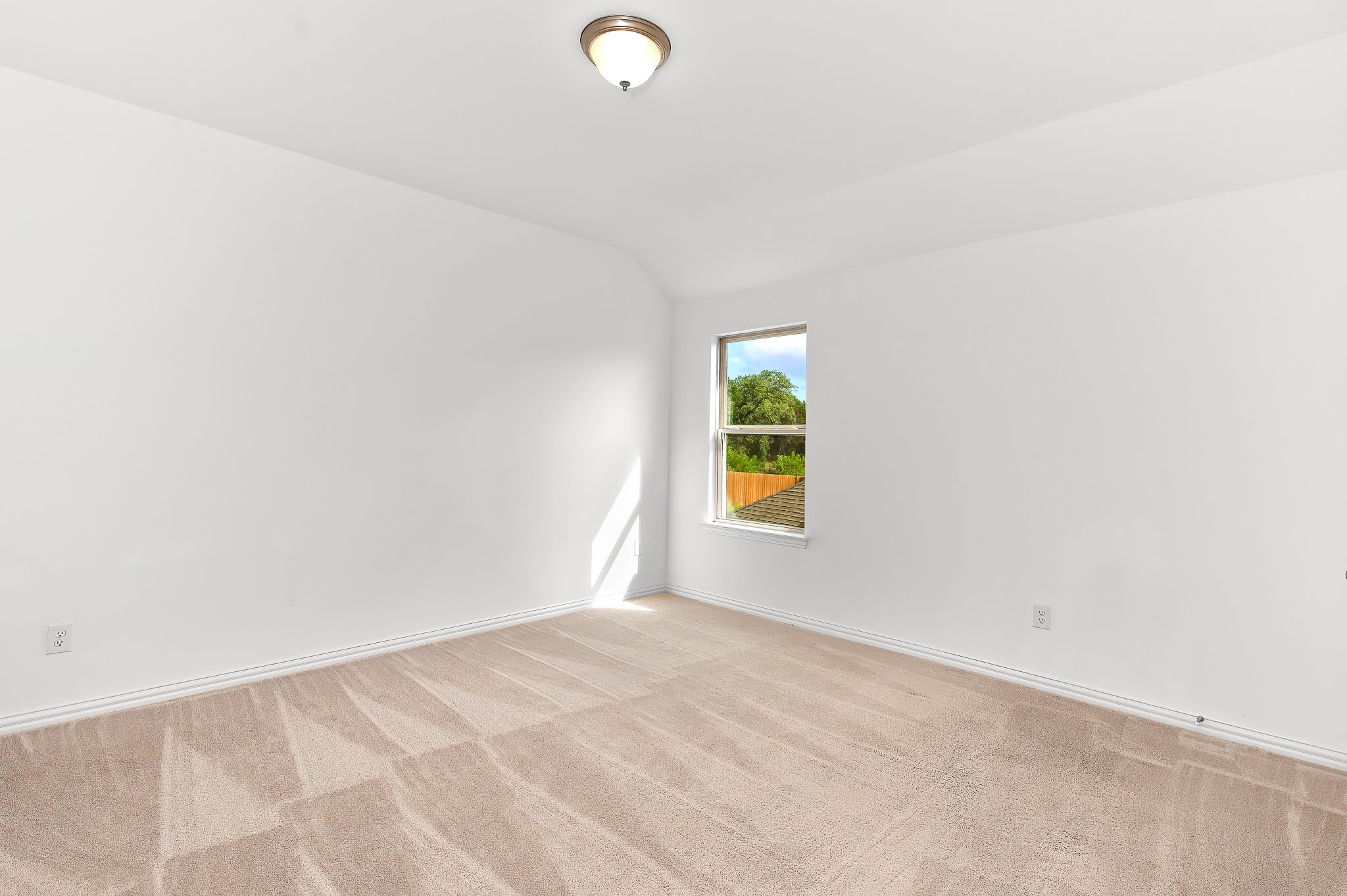 1128 Ridge Runner Drive Georgetown, TX 78628 - Photo 31 of 40 Spare room with vaulted ceiling and light colored carpet