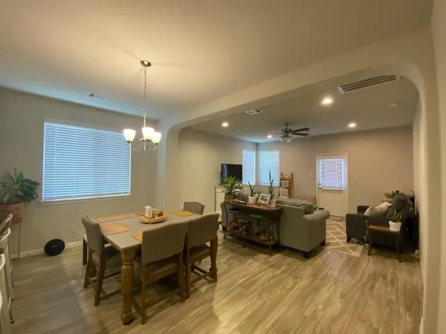 a living room with furniture and a table