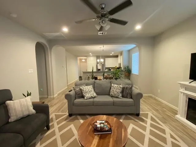 a living room with furniture and a flat screen tv