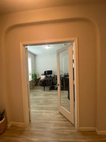 a view of a livingroom with furniture and front door