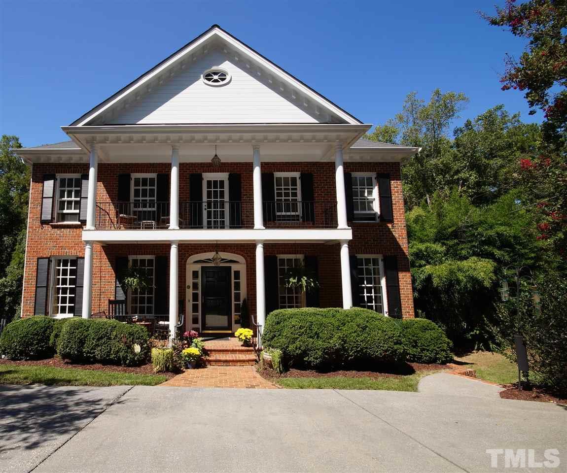 1217 Weldon Place Raleigh, NC 27608 - Photo 1 of 24 a front view of a house with yard and green space