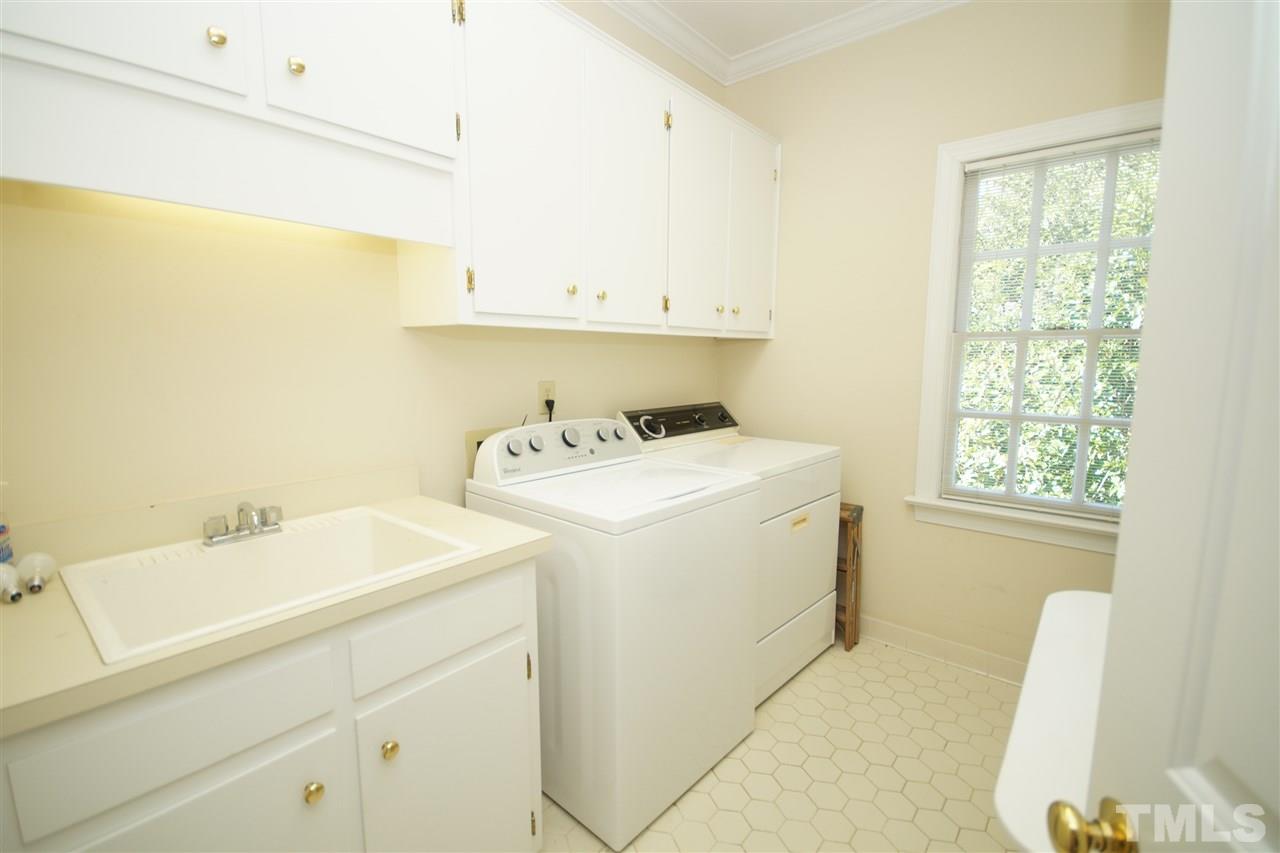 1217 Weldon Place Raleigh, NC 27608 - Photo 12 of 24 a utility room with dryer and washer