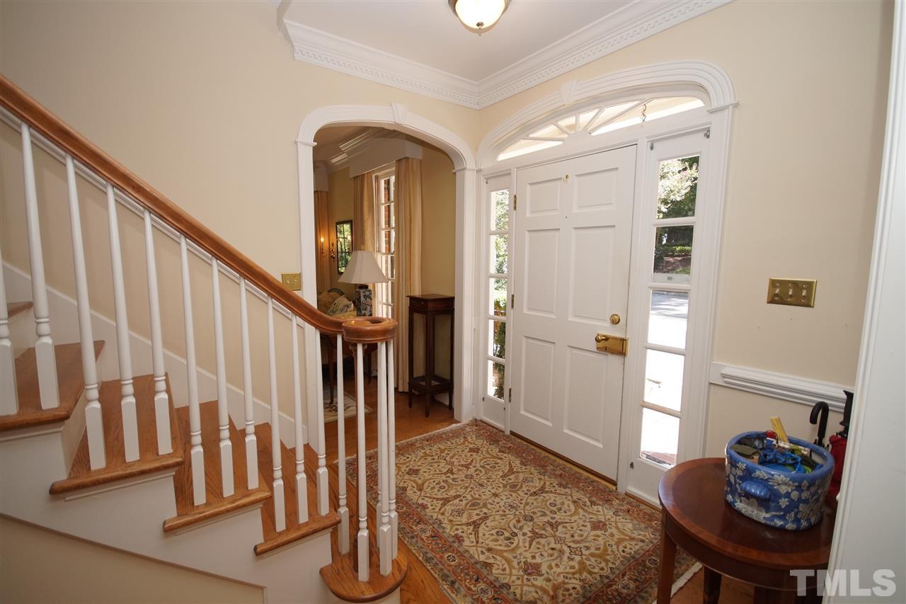 1217 Weldon Place Raleigh, NC 27608 - Photo 2 of 24 a view of entryway and hall with wooden floor
