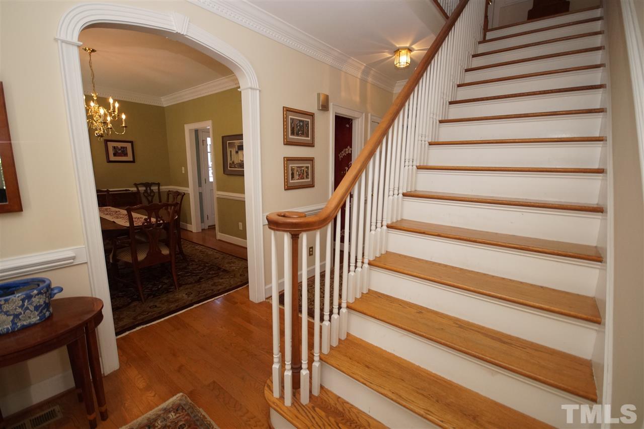 1217 Weldon Place Raleigh, NC 27608 - Photo 3 of 24 a view of entryway and hall with wooden floor