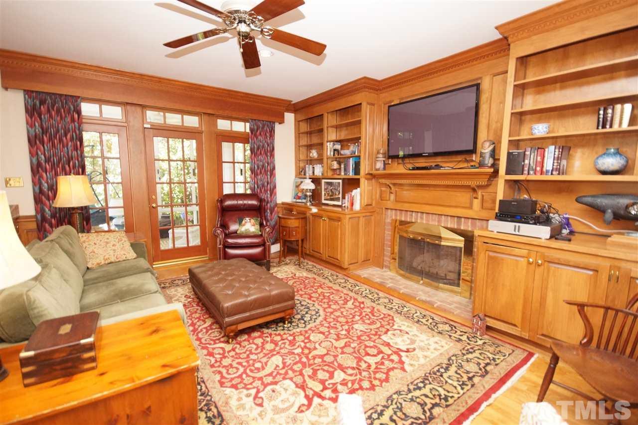 1217 Weldon Place Raleigh, NC 27608 - Photo 6 of 24 a living room with furniture fireplace and flat screen tv