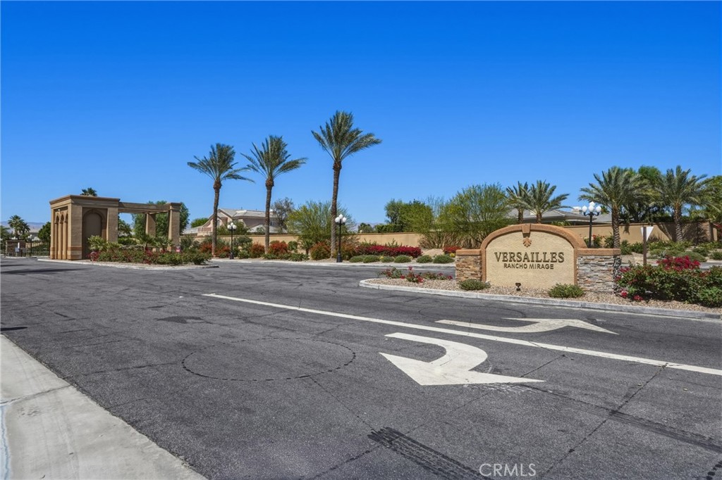 9 Orleans Road Rancho Mirage, CA 92270 - Photo 6 of 71 a view of a street with a building and a street sign