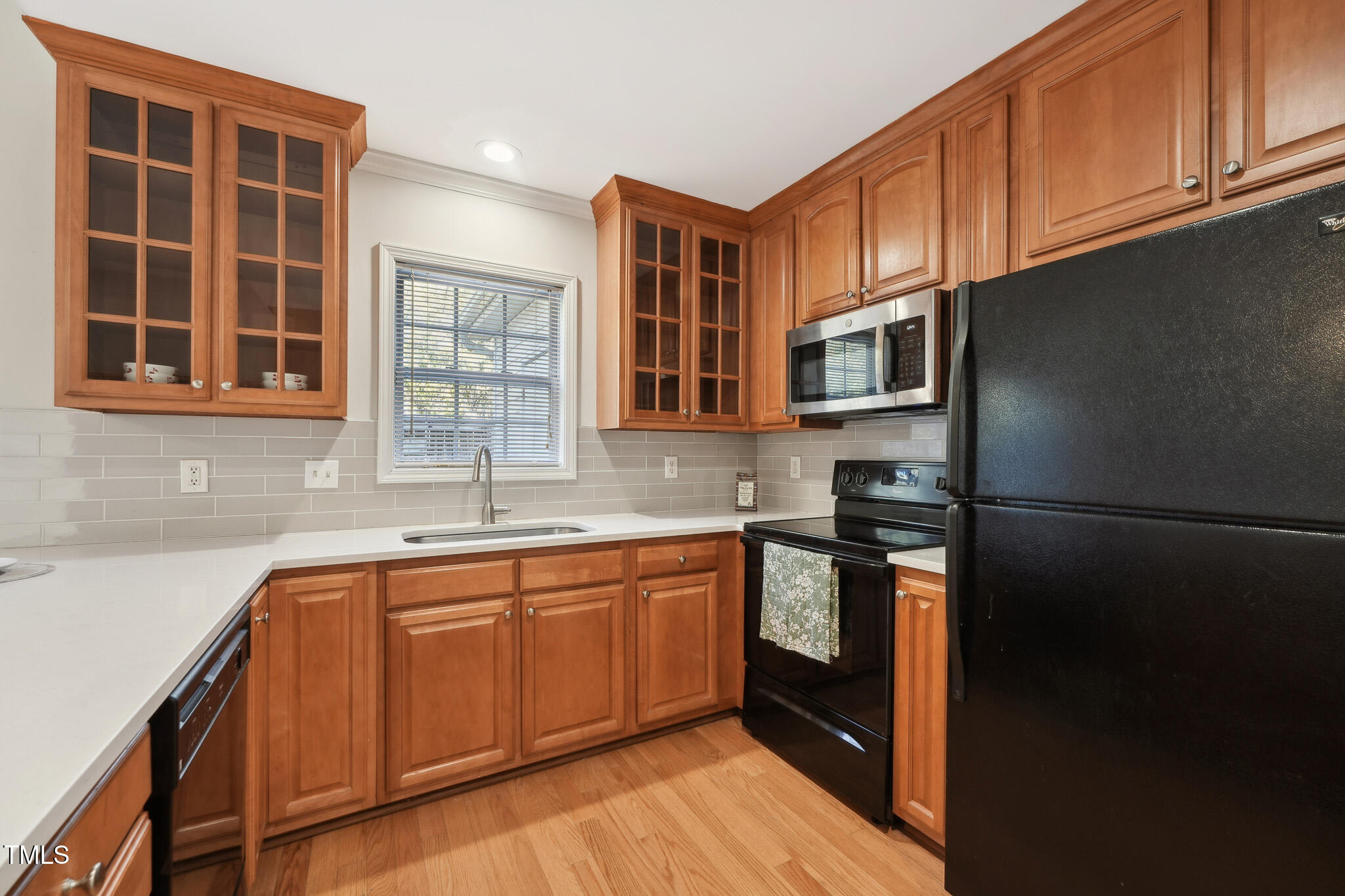 2031 Rivergate Road, Unit 105 Raleigh, NC 27614 - Photo 13 of 29 a kitchen with stainless steel appliances granite countertop a refrigerator and a sink
