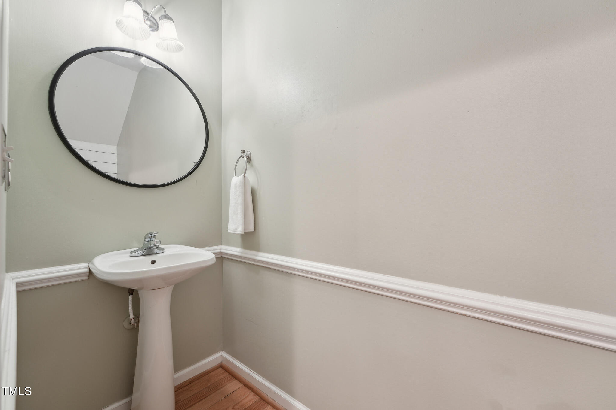 2031 Rivergate Road, Unit 105 Raleigh, NC 27614 - Photo 15 of 29 a bathroom with a sink and a mirror
