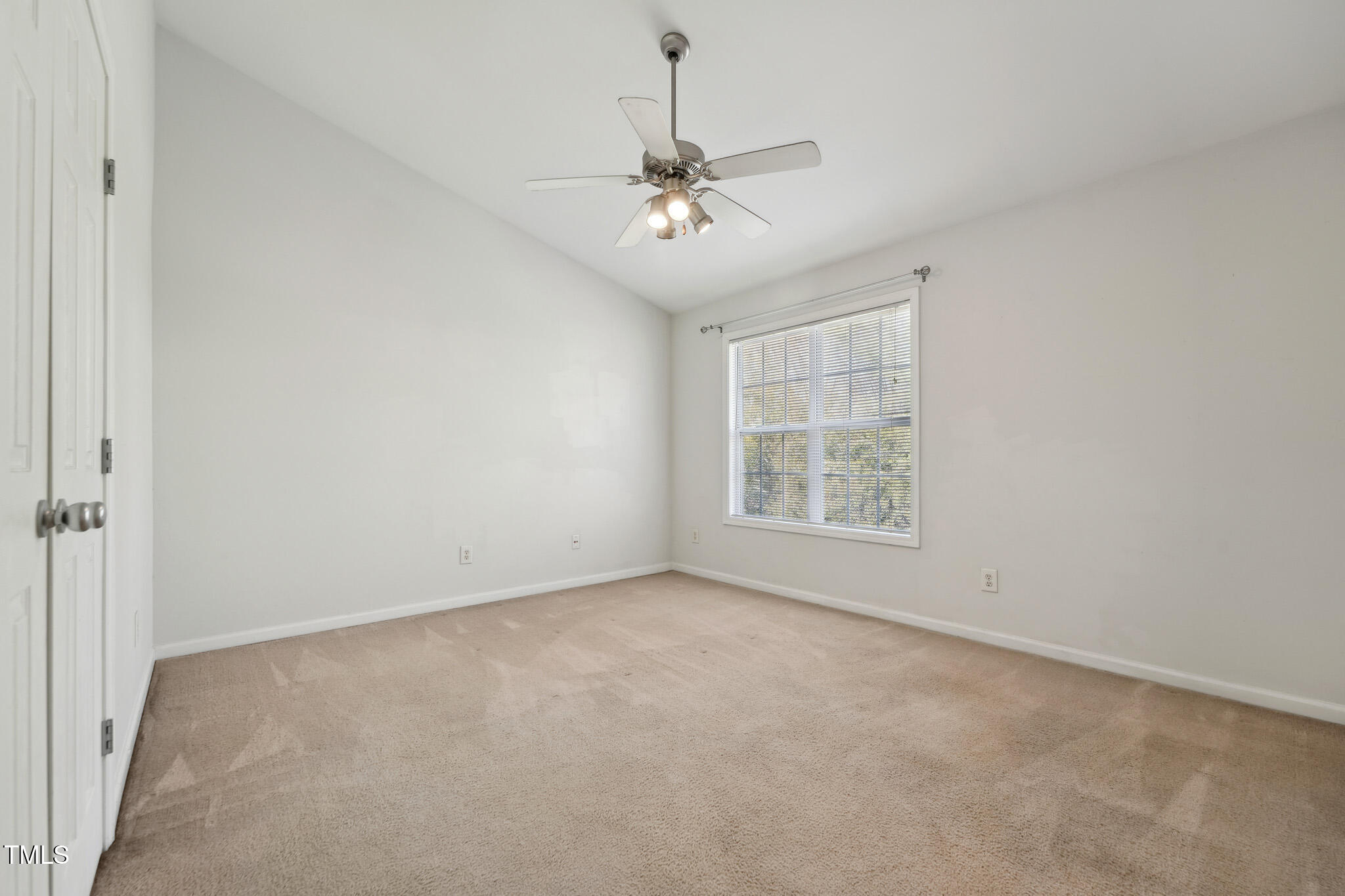 2031 Rivergate Road, Unit 105 Raleigh, NC 27614 - Photo 20 of 29 an empty room with windows and ceiling fan