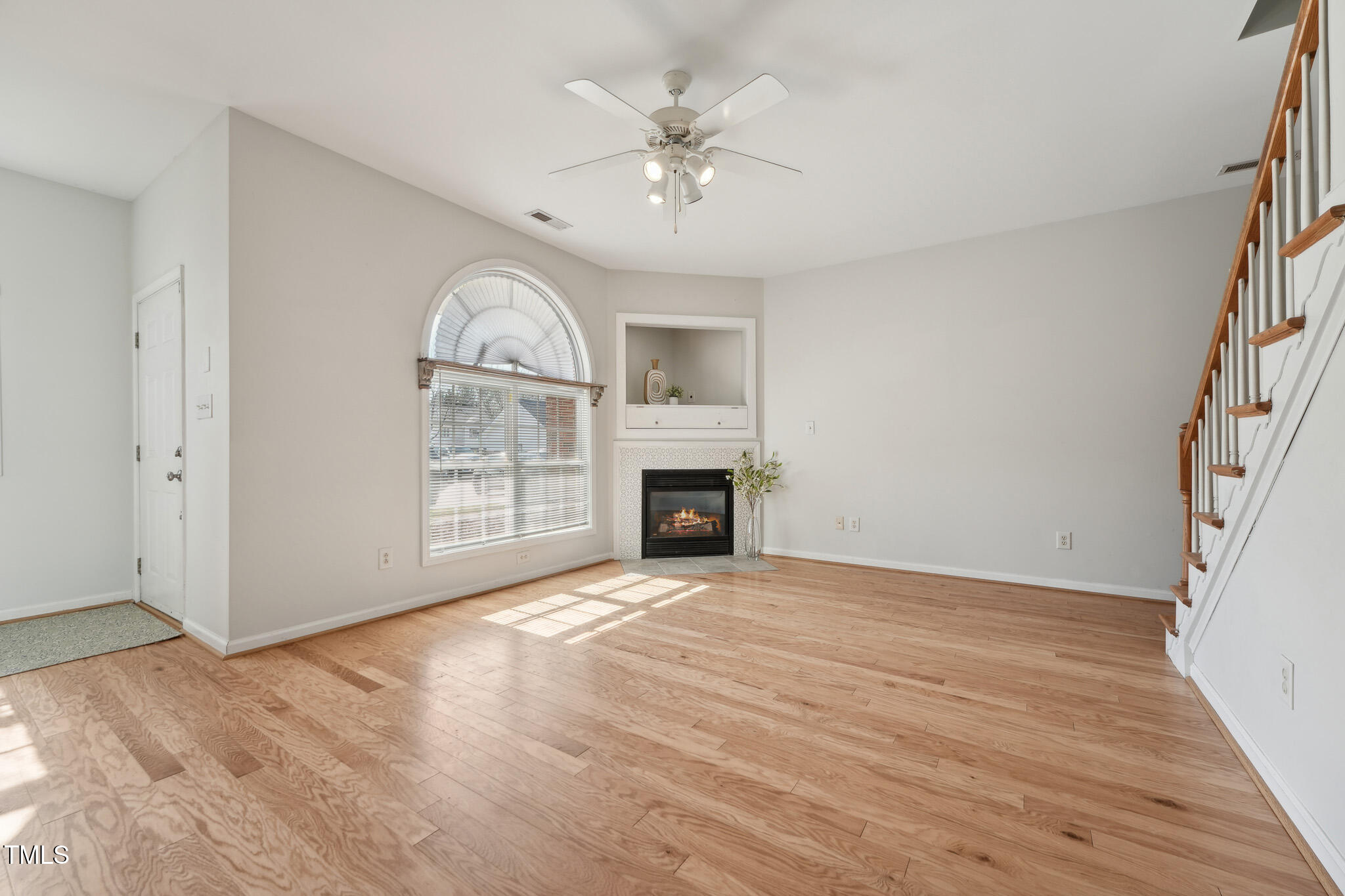 2031 Rivergate Road, Unit 105 Raleigh, NC 27614 - Photo 6 of 29 a view of an empty room with a fireplace and a window