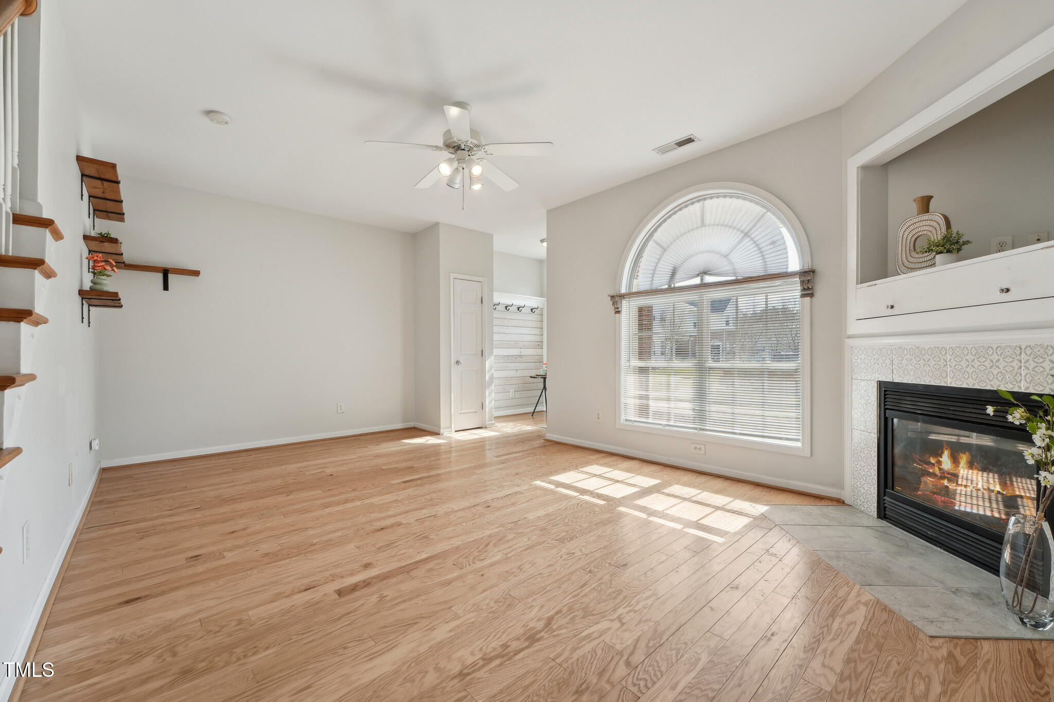 2031 Rivergate Road, Unit 105 Raleigh, NC 27614 - Photo 7 of 29 a view of an empty room with a fireplace and a window