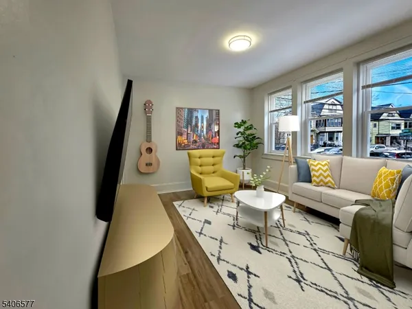 a living room with furniture and a rug
