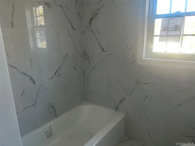 a bathroom with a toilet and a sink