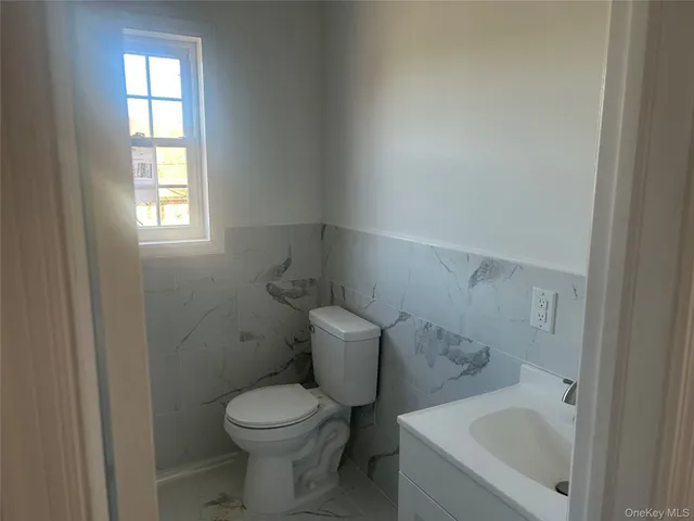 a bath tub sitting in a bathroom next to a window