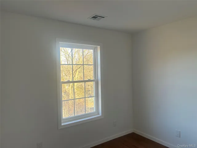 a bath tub sitting in a bathroom next to a window