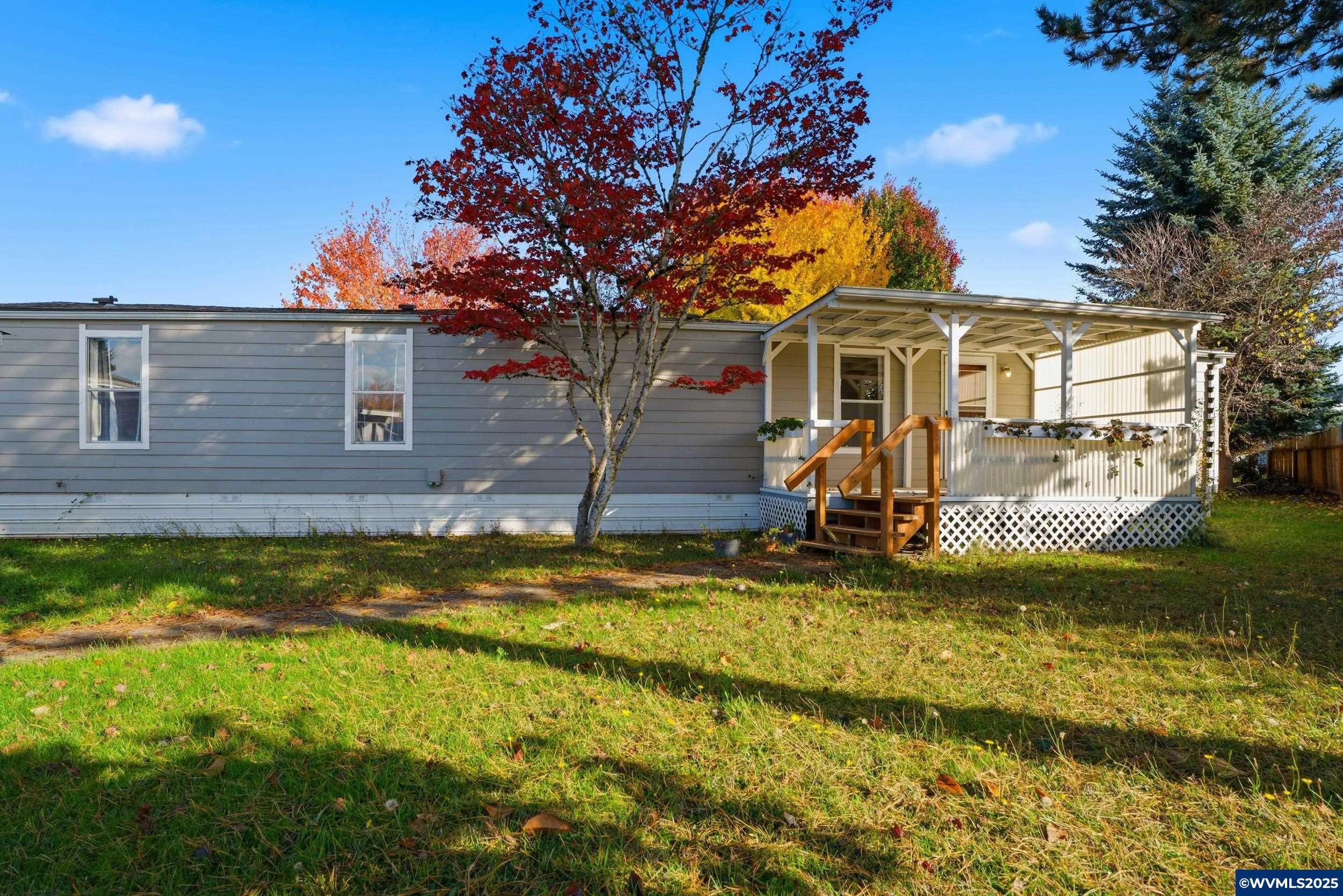 277 Edwards Road, Unit 145 Monmouth, OR 97361 - Photo 35 of 47 a view of a house with a yard