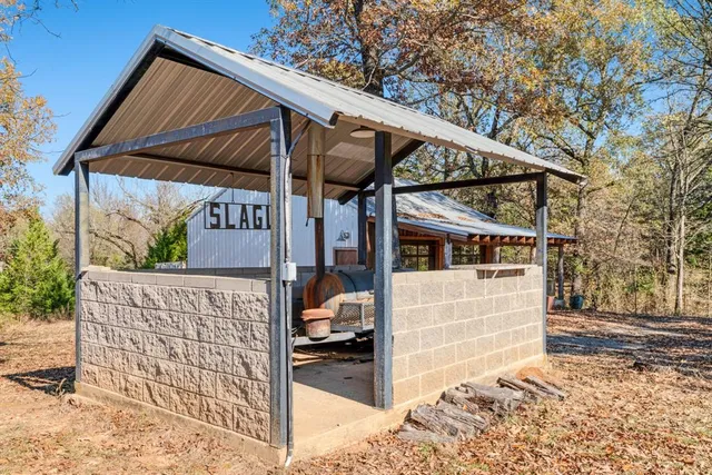 a view of a roof deck with a chair and table