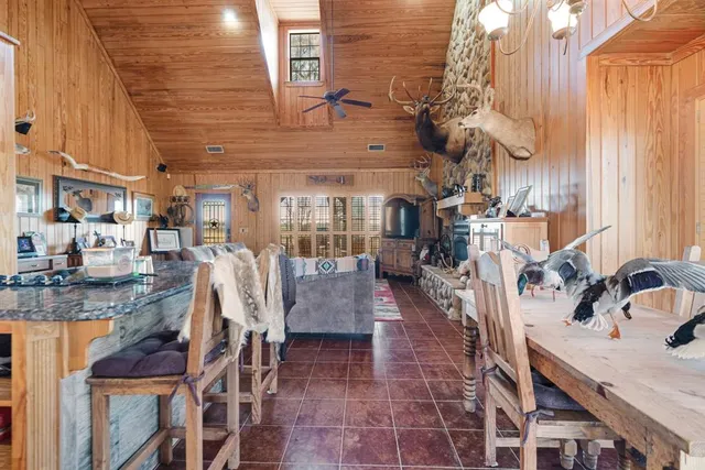 a view of a patio with a table and chairs