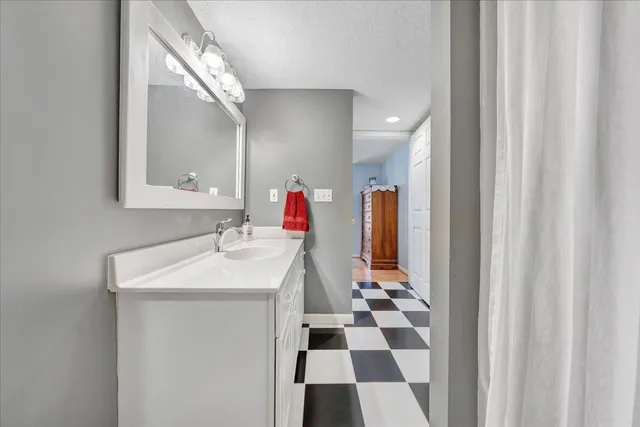 a bedroom with a bed and a cabinets