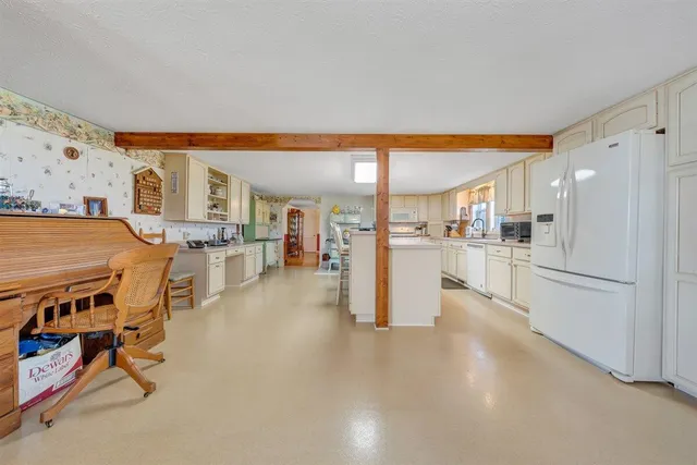 a kitchen with stainless steel appliances granite countertop lots of counter top space and a sink