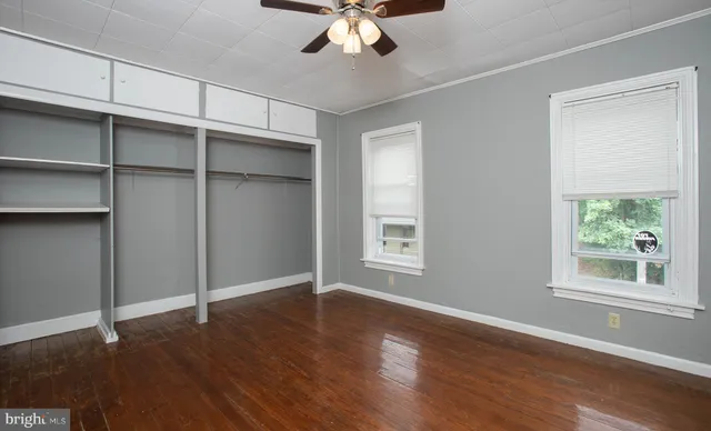 a view of wooden floor and cabinet
