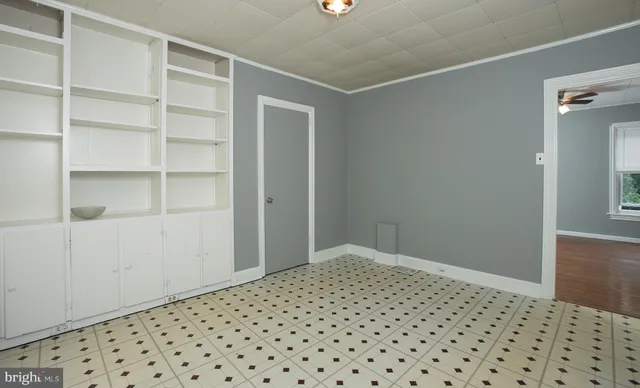 a view of an empty room with a window