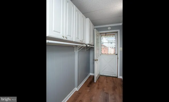 an empty room with wooden floor