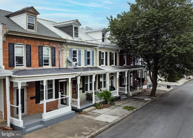 a view of house with wooden fence