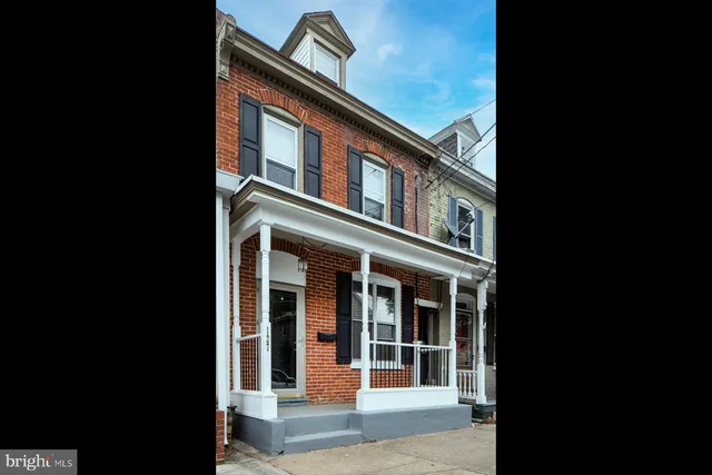 an aerial view of a house with outdoor space