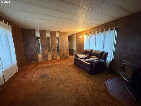 a bedroom with a bed and a shower