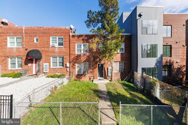 front view of a building with a garden