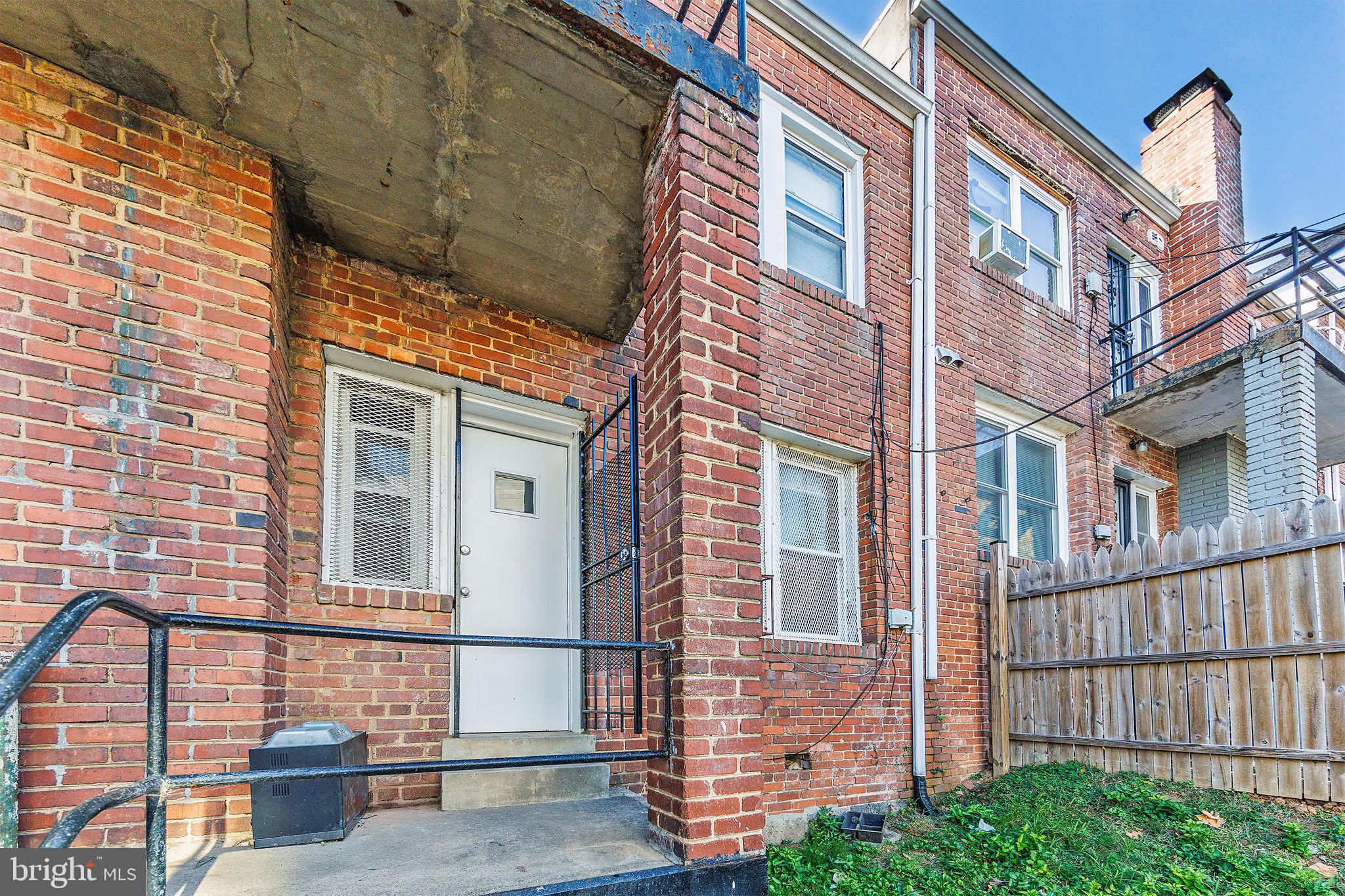 905 19th Street Northeast, Unit 1 Washington, DC 20002 - Photo 17 of 21 a view of a brick building next to a yard