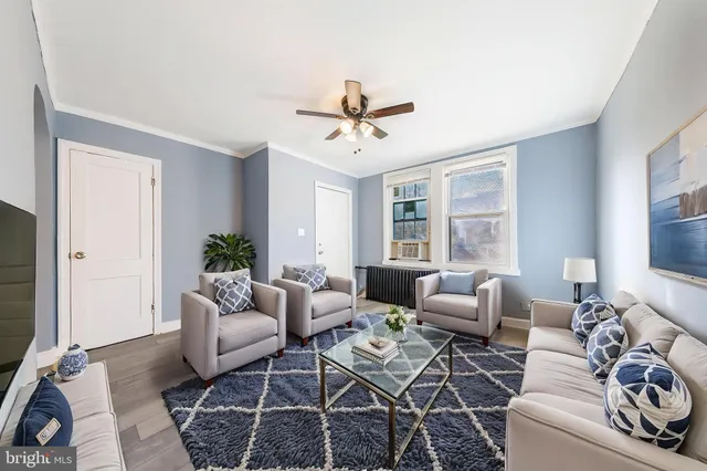 a living room with furniture or couch and a flat screen tv