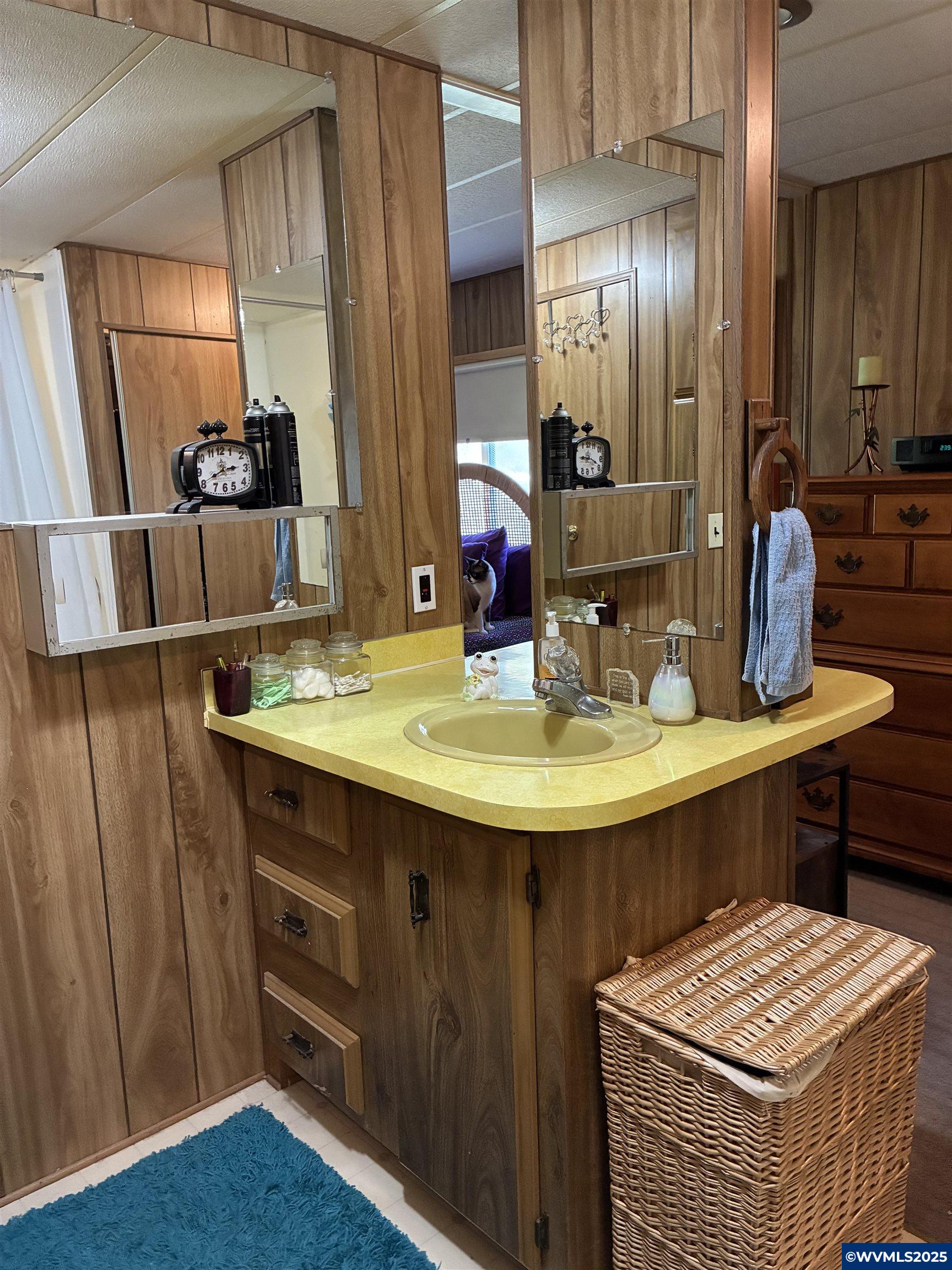 4915 Swegle Road Northeast, Unit 30 Salem, OR 97301 - Photo 18 of 31 a bathroom with a sink and a mirror