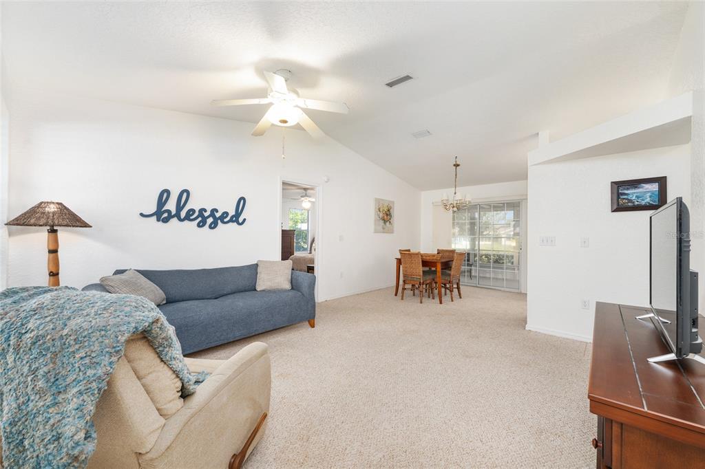 8038 Southwest 108th Loop Ocala, FL 34481 - Photo 7 of 48 a living room with furniture and a table
